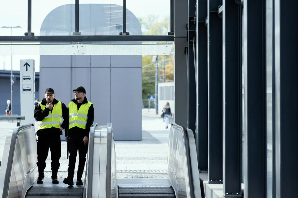 Corporate office security guards in high-visibility vests patrolling a building entrance in Chicago