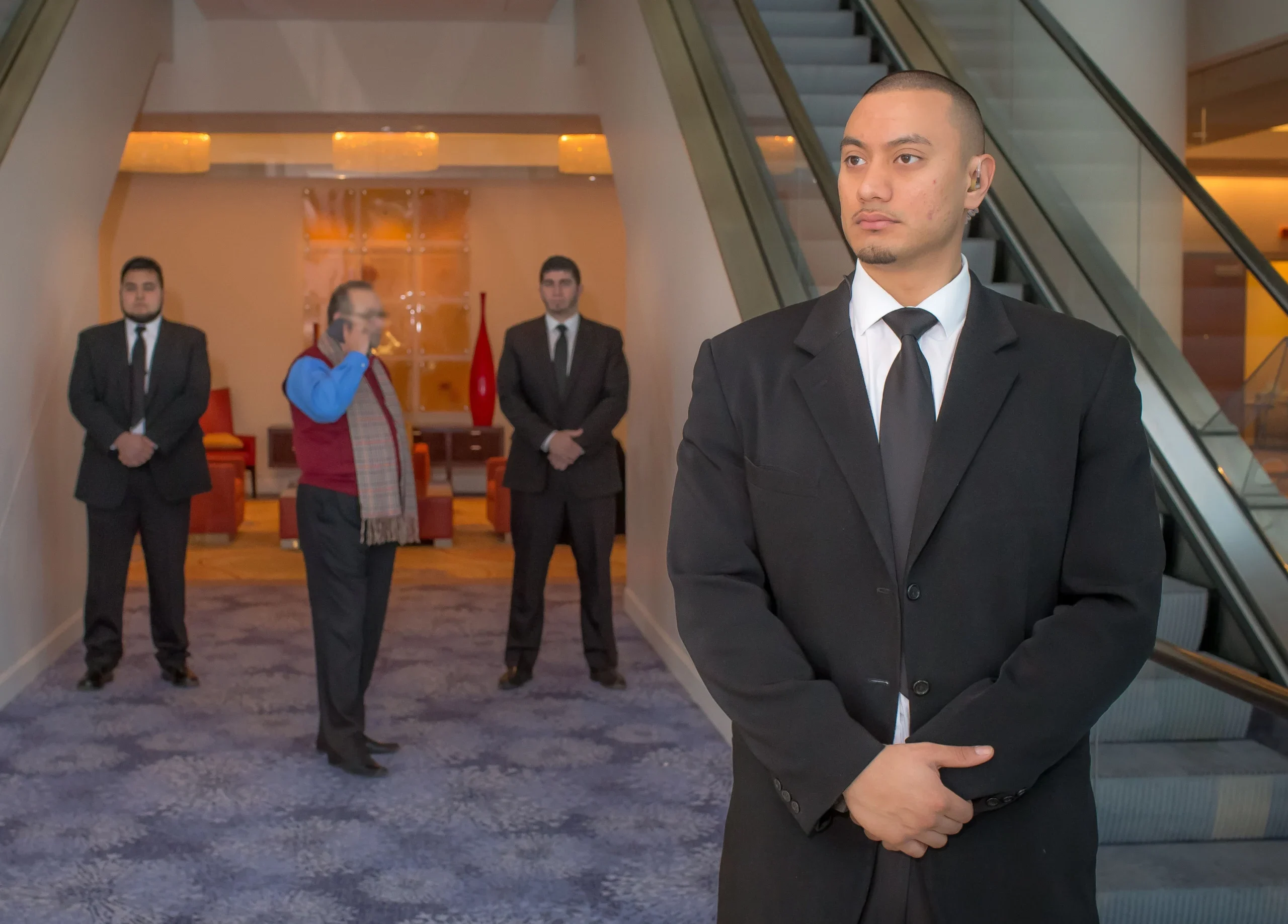emergency-staffing-chicago-illinois-60656 VIP and executive protection officer providing close protection in a corporate lobby in Chicago- 60656