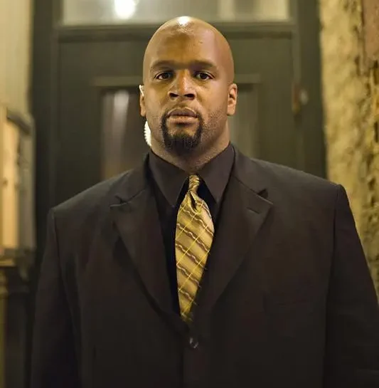 emergency-staffing-chicago-illinois-60656 Professional security officer in a black suit standing in a building lobby