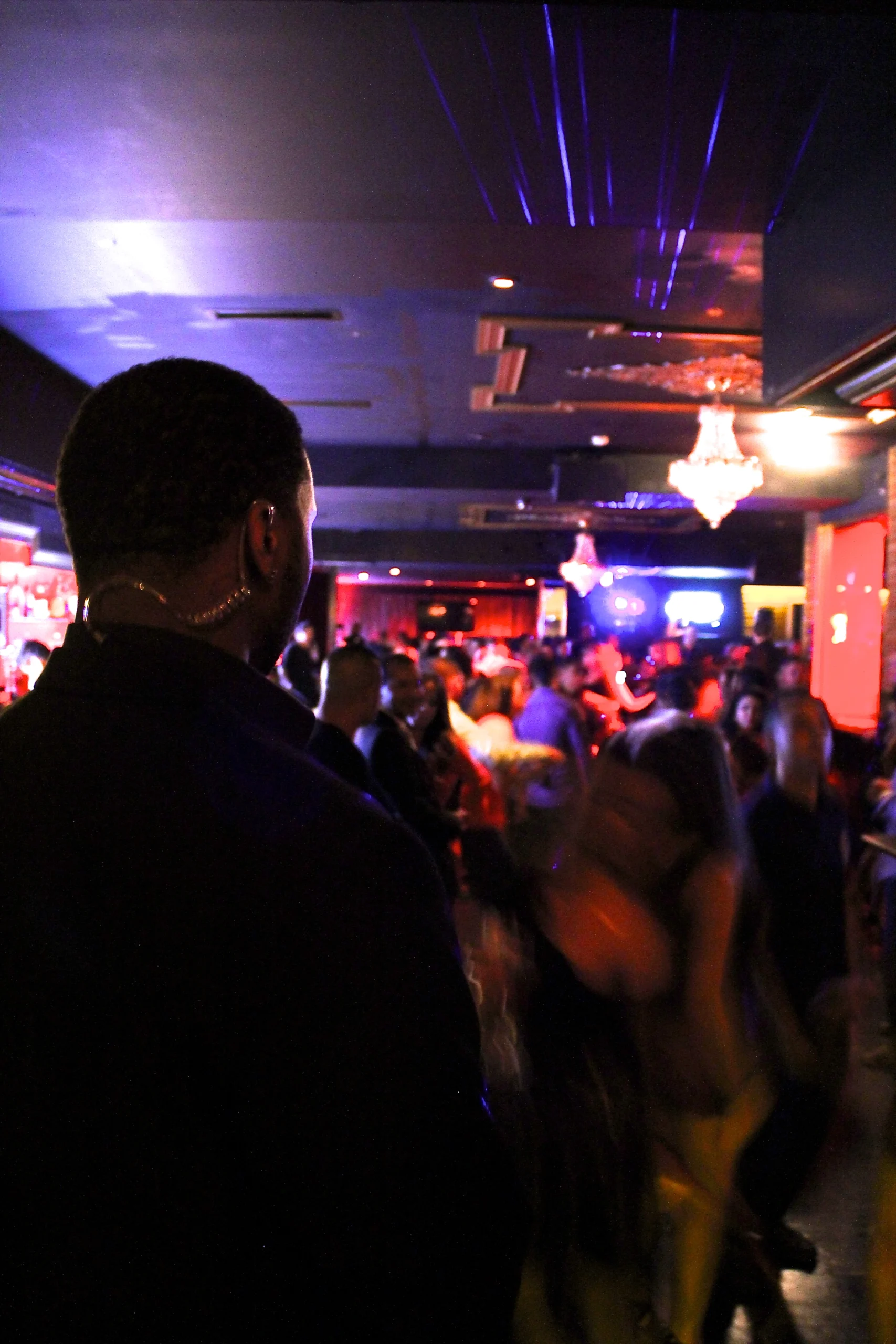 emergency-staffing-chicago-illinois-60656 Event security guard monitoring a crowded nightclub venue during a live event
