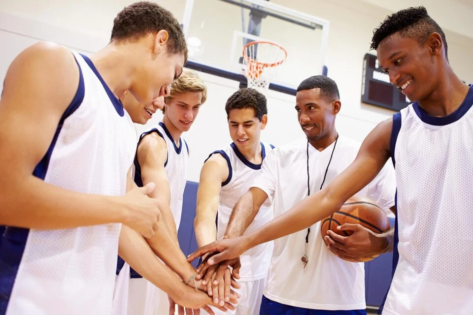 Basketball team huddle in a gym during a sports event in Chicago with event security support